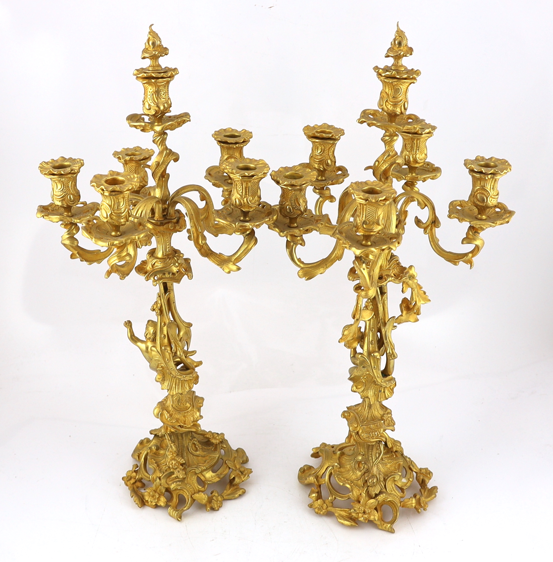 A pair of Victorian style ormolu six light candelabra 66cm high